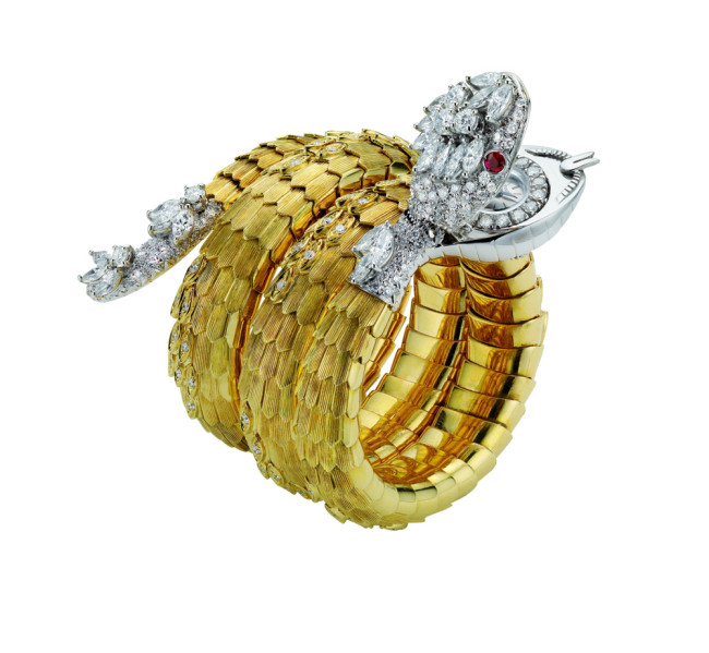 Bulgari, "Serpenti", bracelet-watch in gold with rubies and diamonds, 1967